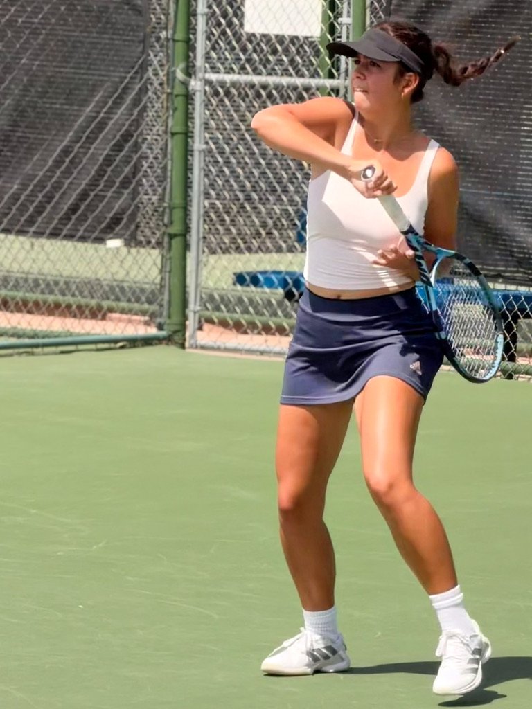 Avery Porter follow-through on forehand — Franklin HS tennis